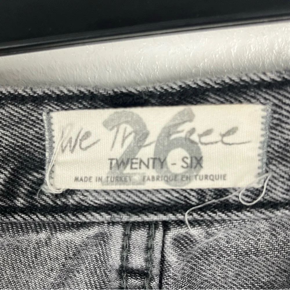 FREE PEOPLE Maggie Black Wash Button Fly Busted Knees Sharkbite Hem Jeans 26